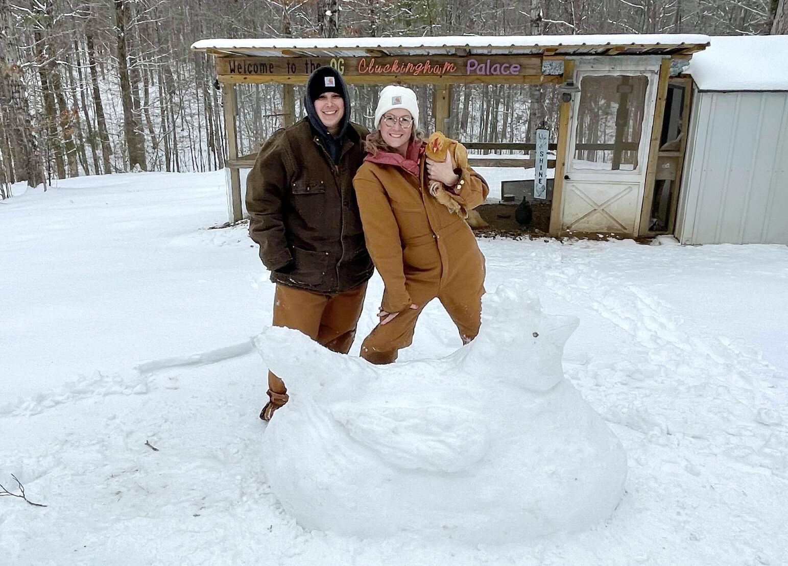 Lola poses for pretty poultry snow sculpture